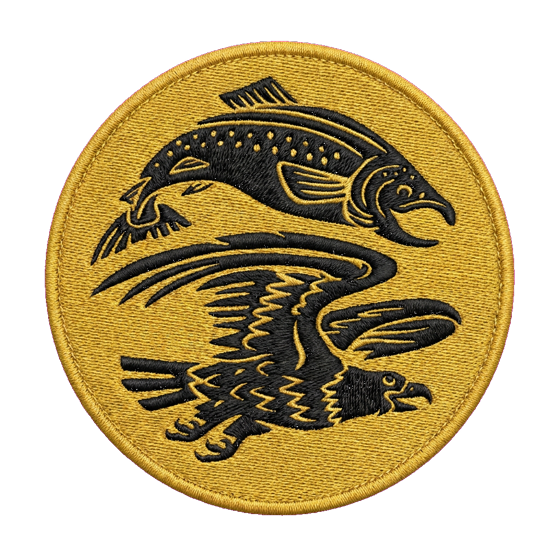 Round gold embroidered patch — a leaping salmon over a diving eagle in black woodcut style